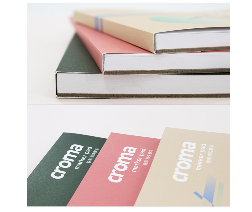 Three notebooks stacked with 'croma' branding on a white background
