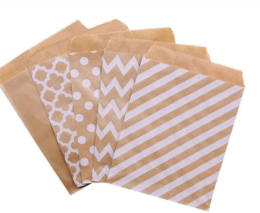 Set of brown paper bags with different patterns on a white background