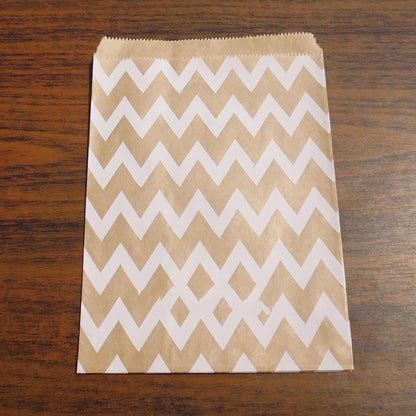 Kraft paper bag with white zigzag pattern on a wooden surface