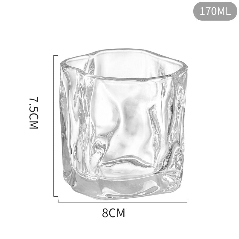 Clear glass tumbler with dimensions on a white background