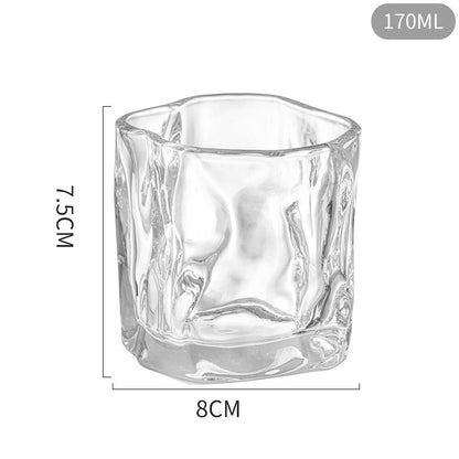 Clear glass tumbler with dimensions on a white background