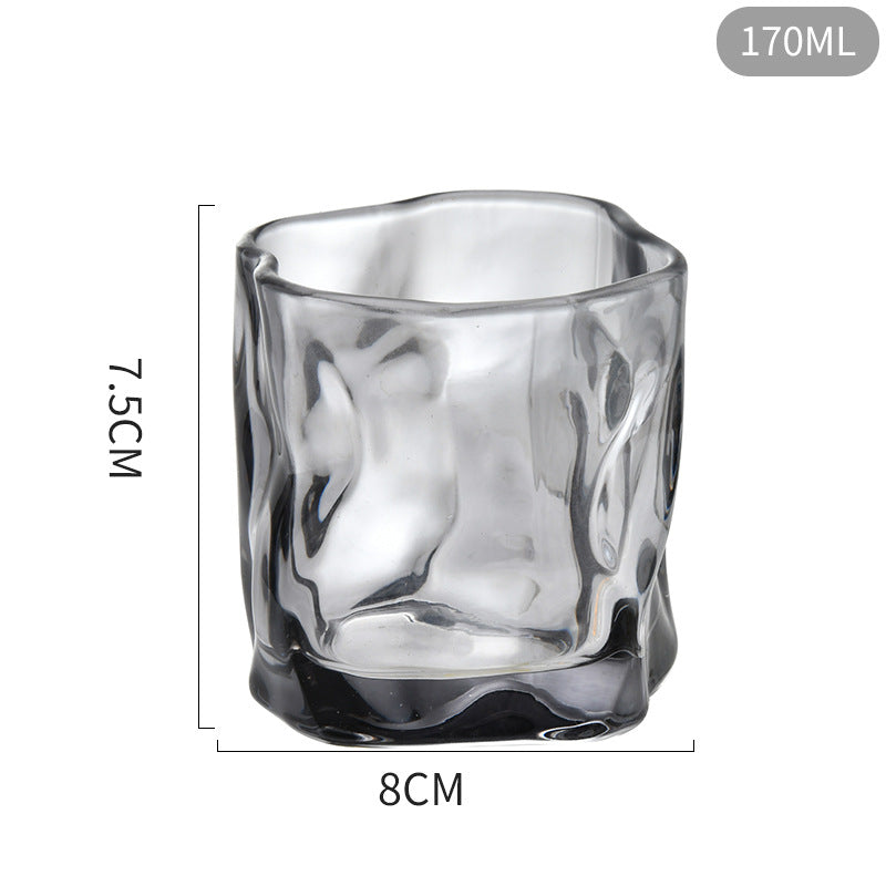 Black glass tumbler with dimensions on a white background