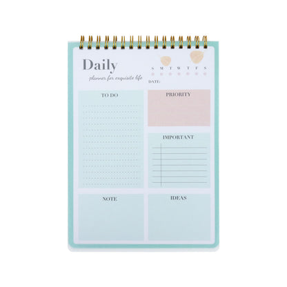 A mint green daily planner with a gold spiral binding, featuring sections for to-do lists, priority, date, notes, and ideas on a white background.