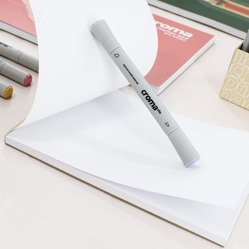 Croma marker on a notebook with other markers in the background