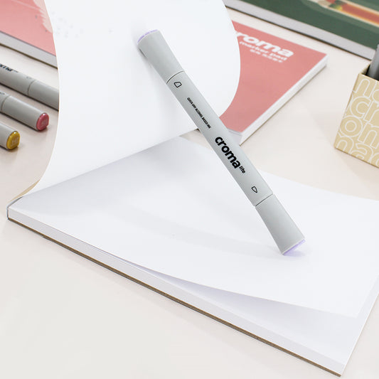 Croma marker on a notebook with other markers in the background