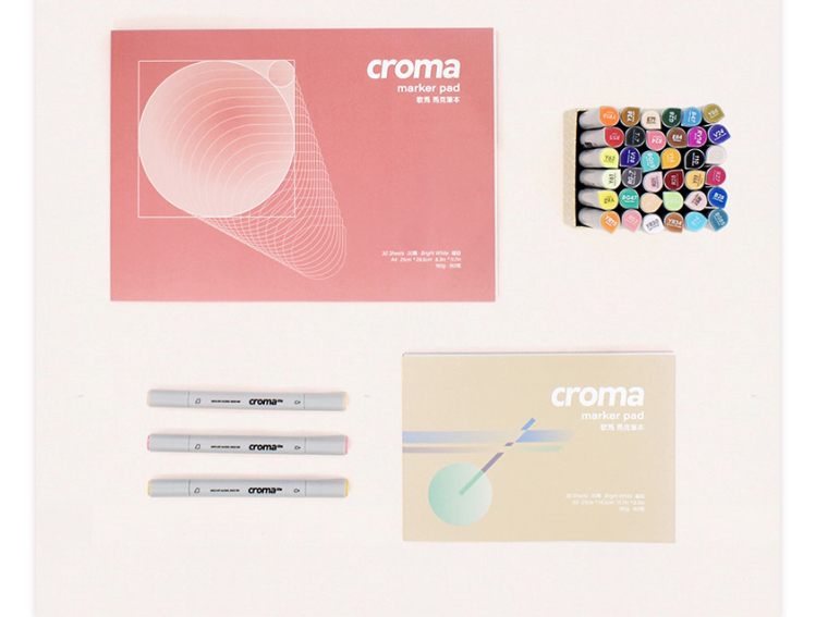 Croma marker set with packaging on a light pink background