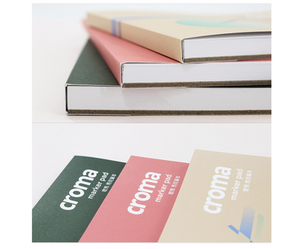 Three notebooks stacked with 'croma' branding on a white background