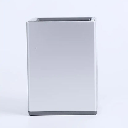 Rectangular metal pen holder on a white background