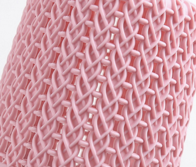 Close-up of pink textured material resembling lace