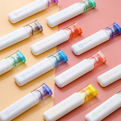 Highlighters with colorful accents on a pink and yellow background