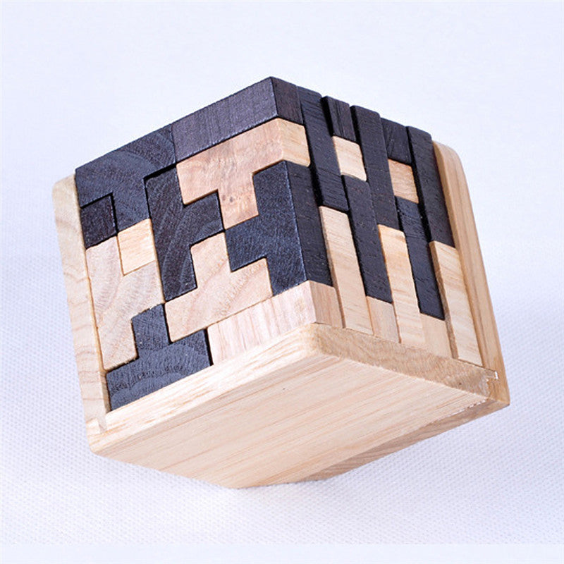 Wooden puzzle cube with a geometric pattern on a light blue background