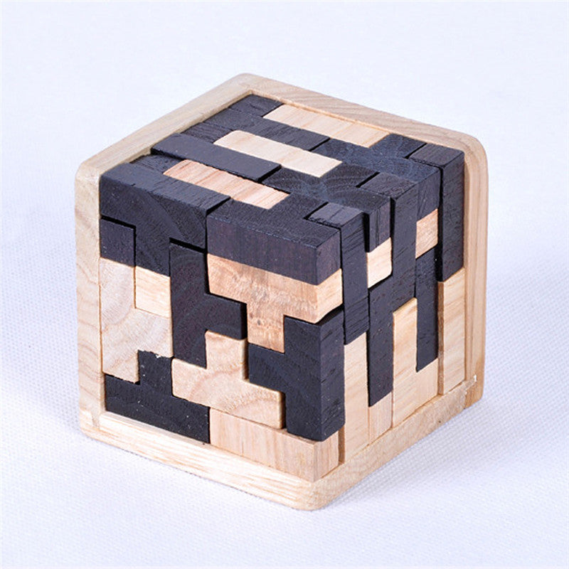 Wooden cube puzzle with black and natural wood pieces on a white background